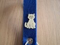 Blauer Schlüsselanhänger mit gelber Katze